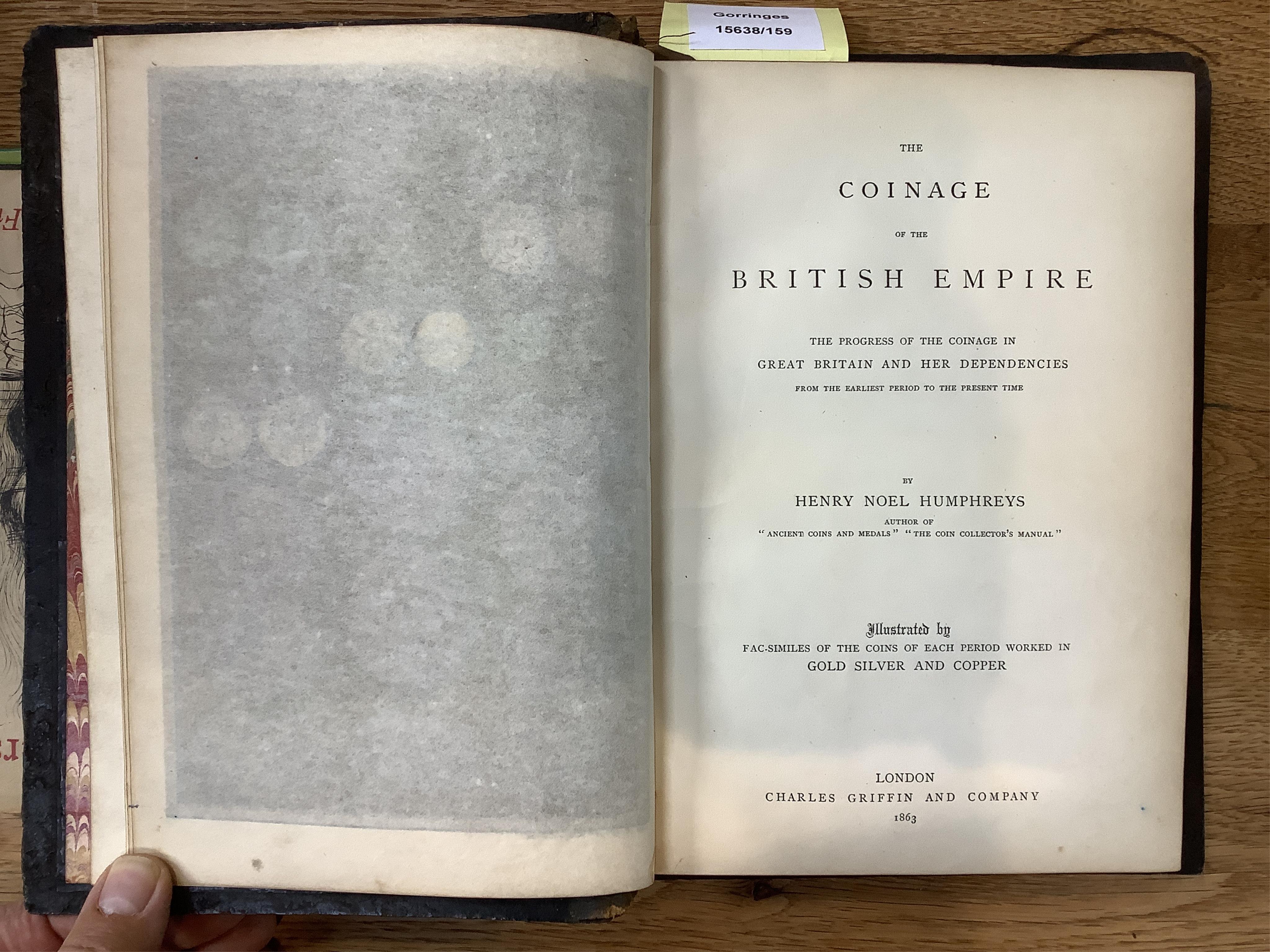 Humphreys, Henry Noel. The coinage of the British Empire. London, 1863. 8vo, 24 plates, papier maché binding with royal coat of arms in relief, original leather spine